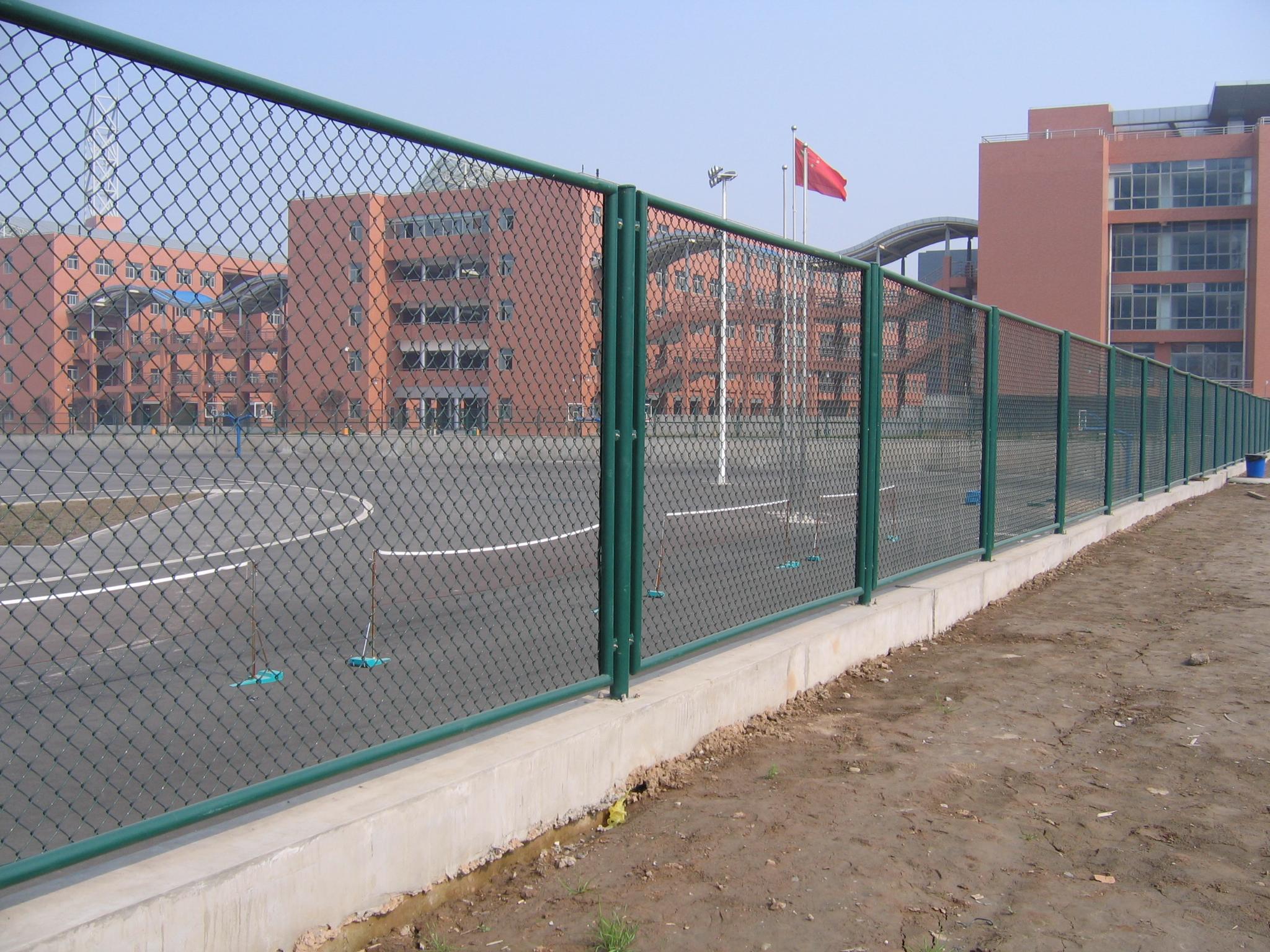 The chain link fence at the stadium The chain link fence at the stadium