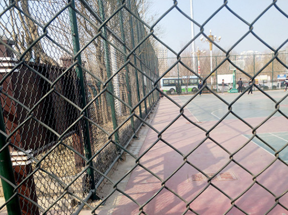 The chain link fence at the stadium The chain link fence at the stadium